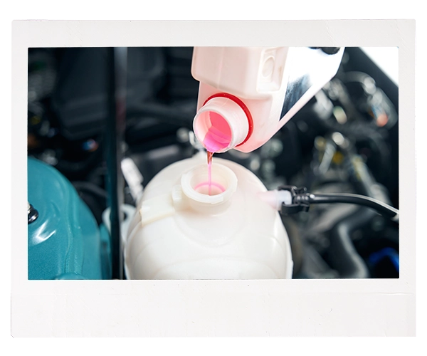 coolant pouring into reservoir in engine