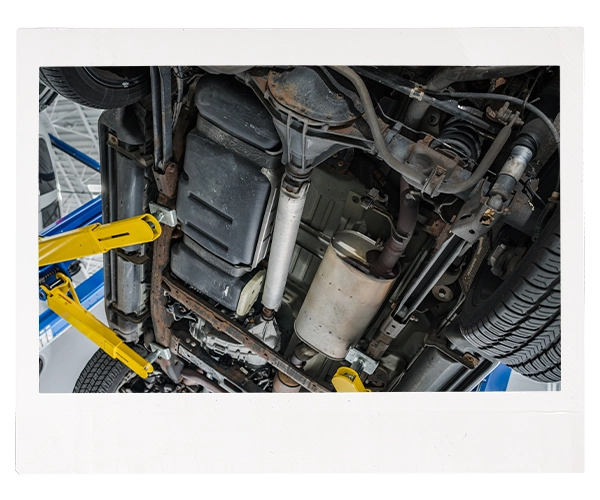 underside of a car on a lift