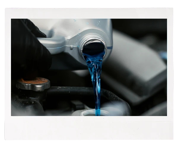coolant being poured into radiator reservoir